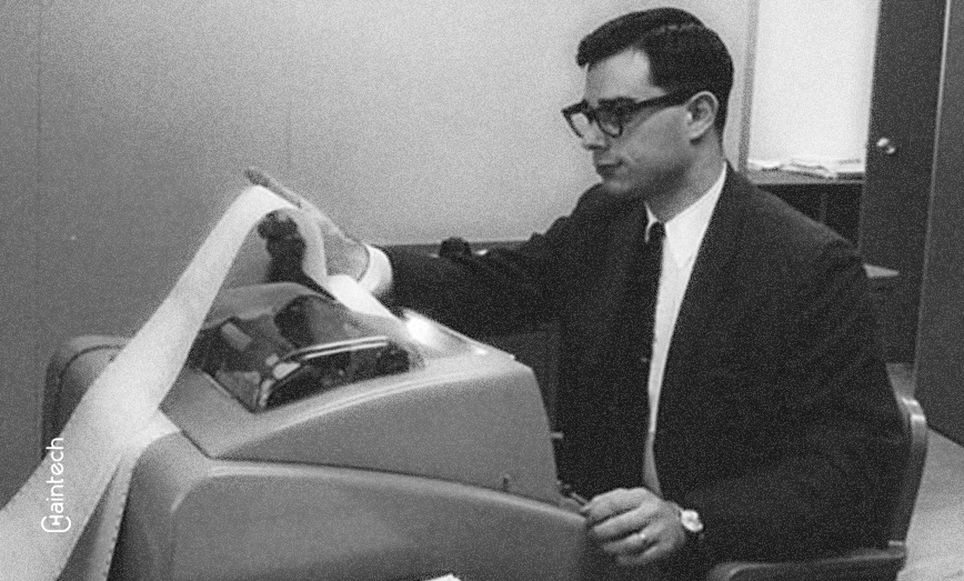 An image depicting Allan Scherr, a pioneering figure in cyber history, engaged with early computing equipment, showcasing his innovative contributions during the 1960s