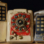 Old-fashioned rotary dial phones symbolizing the history of phone phreaking